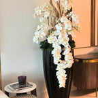 San Jose Vase in glossy black with hanging yellow orchids – The Ever Botanic